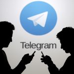 Vietnam Will Soon block Telegram, App Owners are Surprised Two men pose with smartphones in front of a screen showing the Telegram logo in this picture illustration taken in Zenica