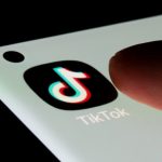 TikTok Avoids Trial, Settles Lawsuit Over Addiction Claims FILE PHOTO: TikTok app is seen on a smartphone in this illustration