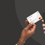 Partnership Deal: FCMB, NetPlusDotCom, & MasterCard Debut The “Tap on Phone” Software POS paying-with-card-on-phone-1300×650