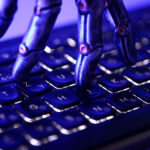Illustration shows keyboard and a robotic hand